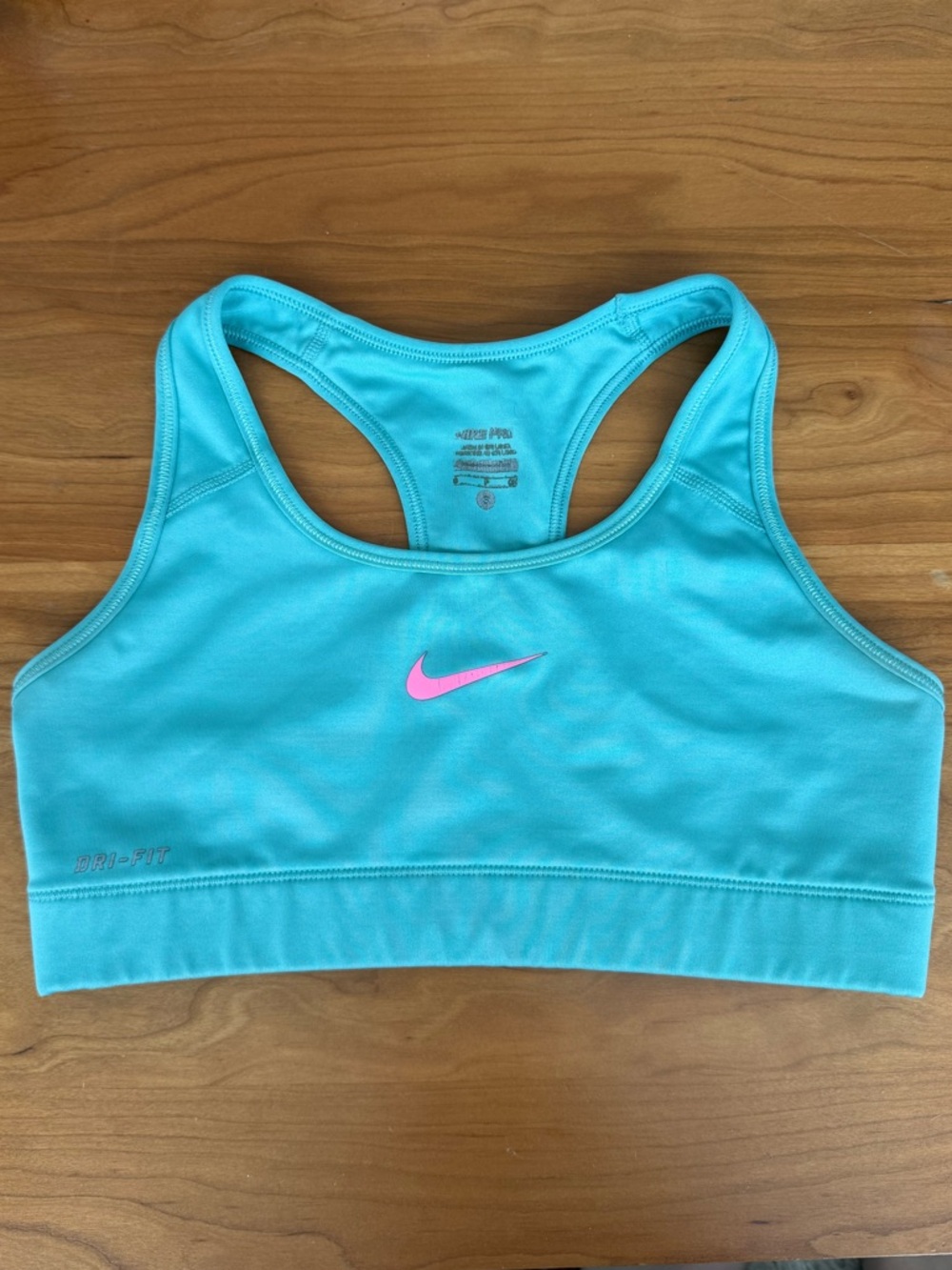 Nike Dri-Fit Aqua/light blue Sports Bra with Pink Swoosh. Size small.